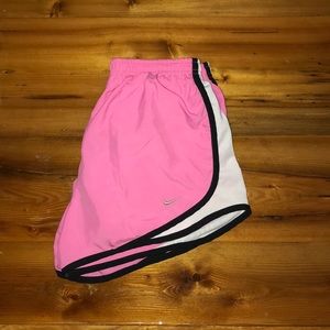 Pink Nike shorts.
